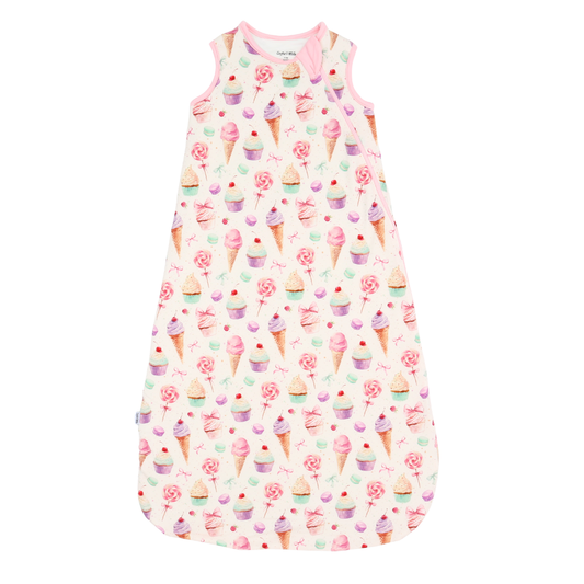 Baby sleeping bag with ice cream and cupcake pattern on a white background
