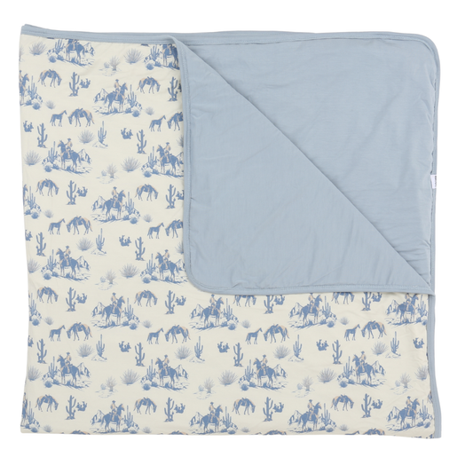 Baby blanket with blue and white pattern on a white background