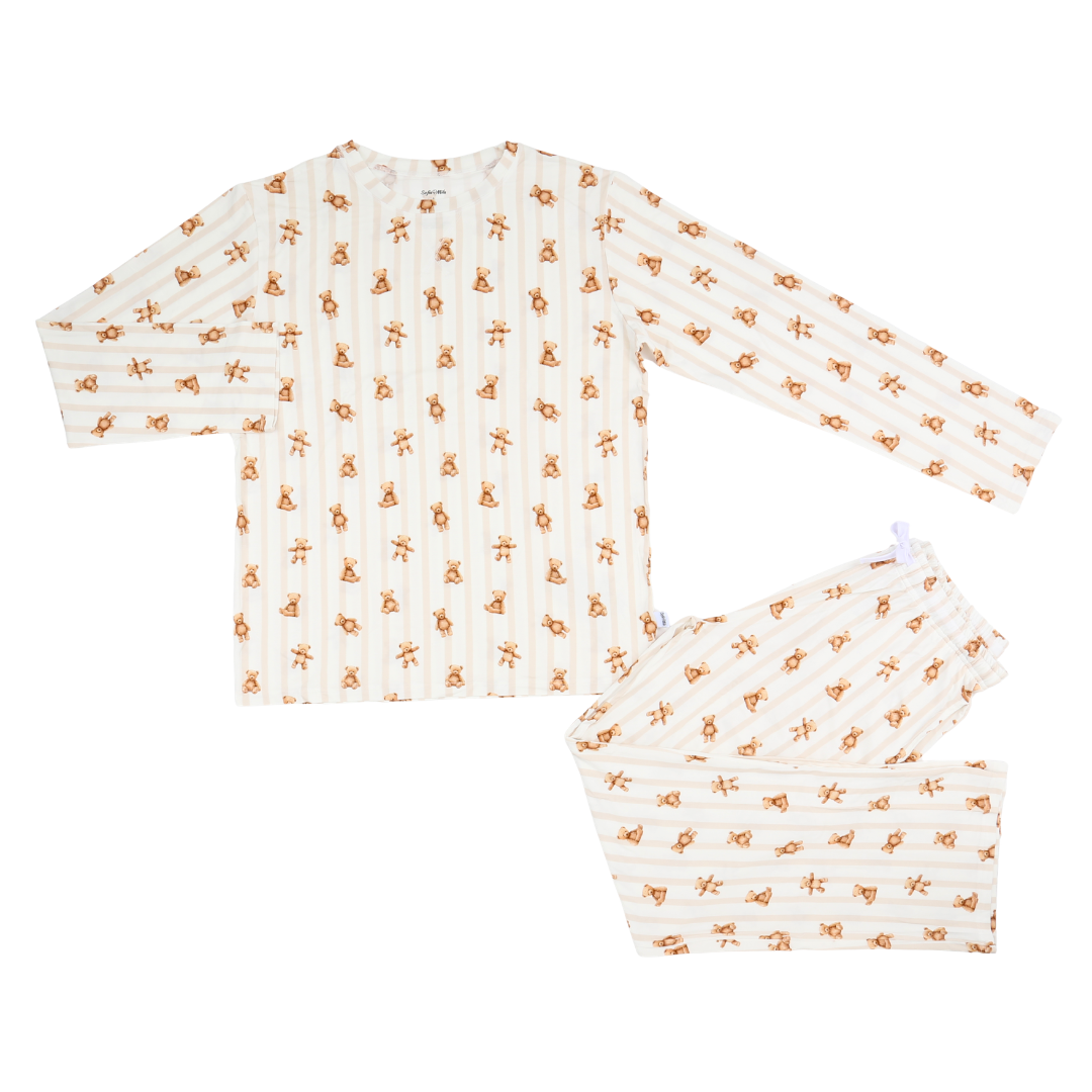 Baby outfit with long-sleeve top and pants featuring a small pattern on a white background