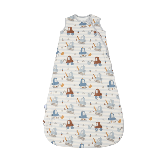 A baby sleep sack with a white and light blue striped background, featuring an all-over print of cartoon construction vehicles in brown and blue, set against a plain white background.