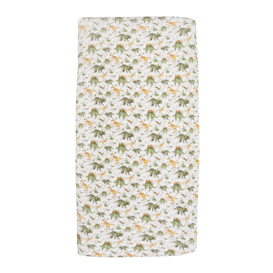 A rectangular baby blanket with an all-over dinosaur print on a white background, featuring green, yellow, and orange dinosaurs.