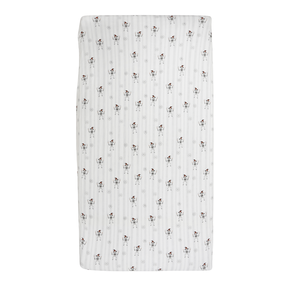 A rectangular muslin baby swaddle blanket with a white background, featuring a repeating pattern of small black and brown dog illustrations and subtle vertical gray stripes.
