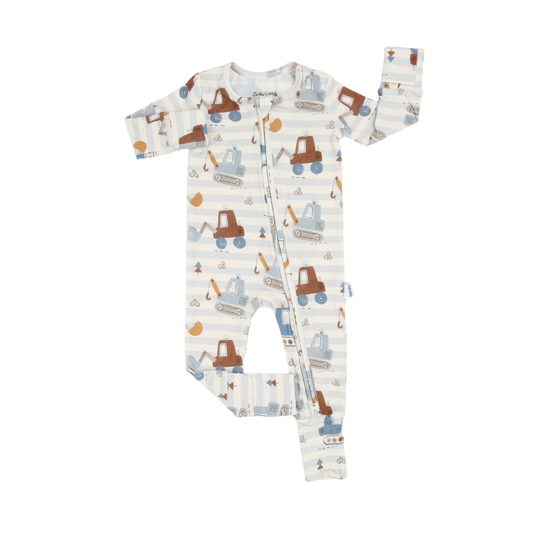 A baby long-sleeve footless sleeper with a front zipper, featuring a playful print of construction vehicles and machinery on a white and light blue striped background.