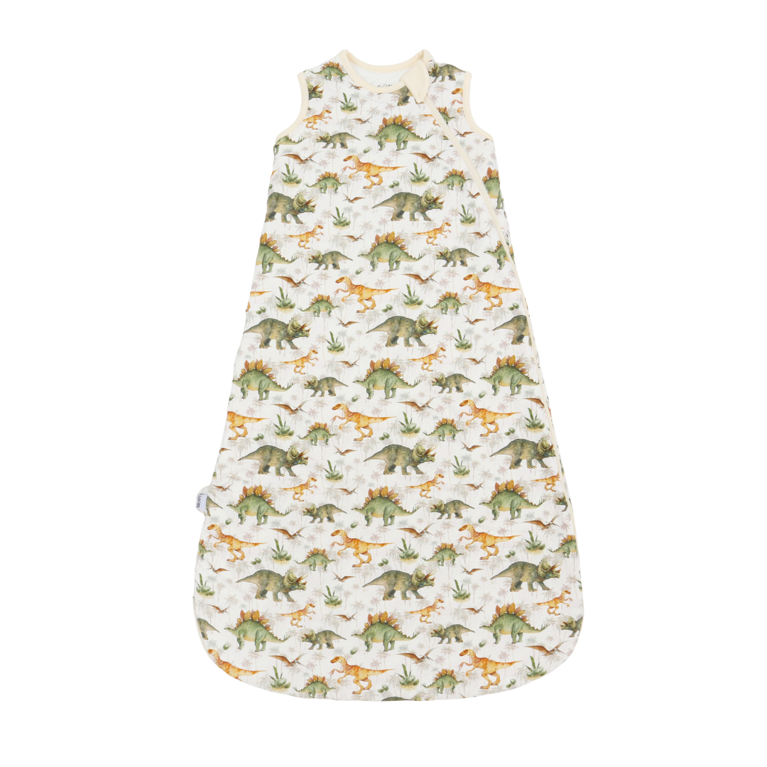 A sleeveless baby sleep sack with an all-over dinosaur print on a cream-colored background, shown flat against a white background.