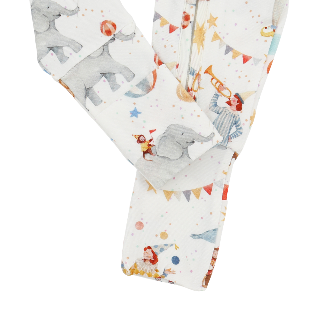 Baby leggings with elephant and circus-themed print on a white background
