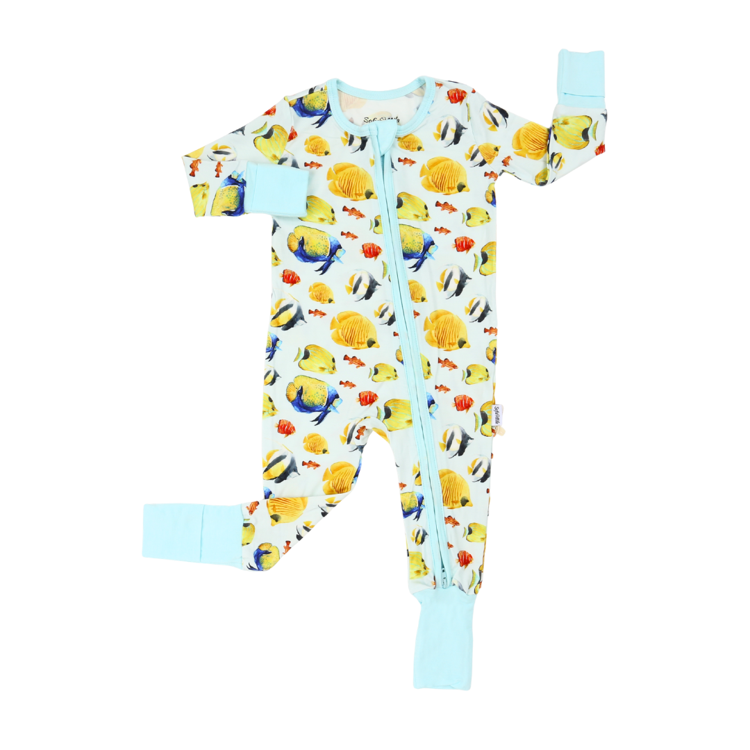 Baby onesie with fish pattern on a white background
