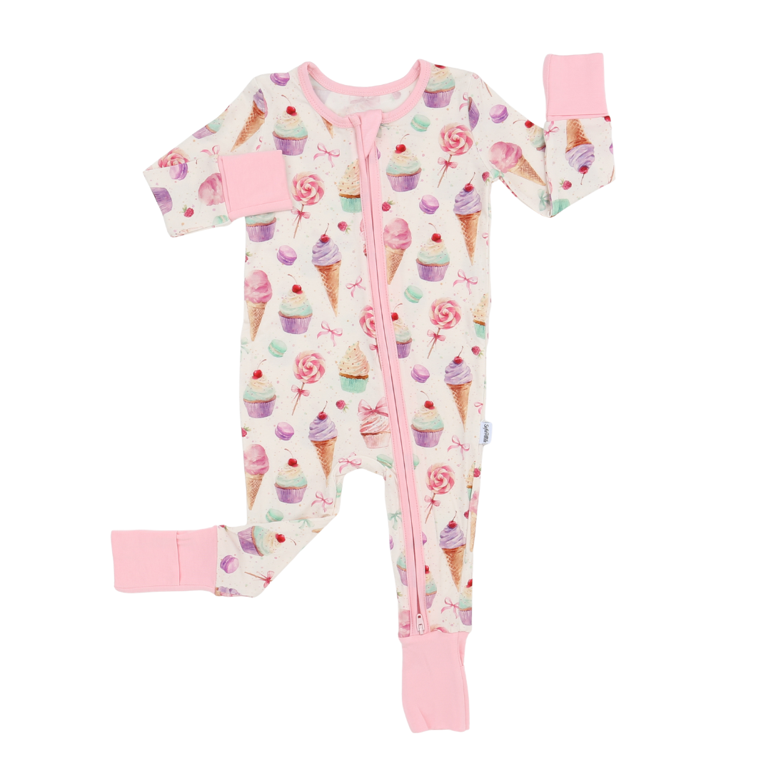 Baby onesie with ice cream cone and cupcake pattern on a white background