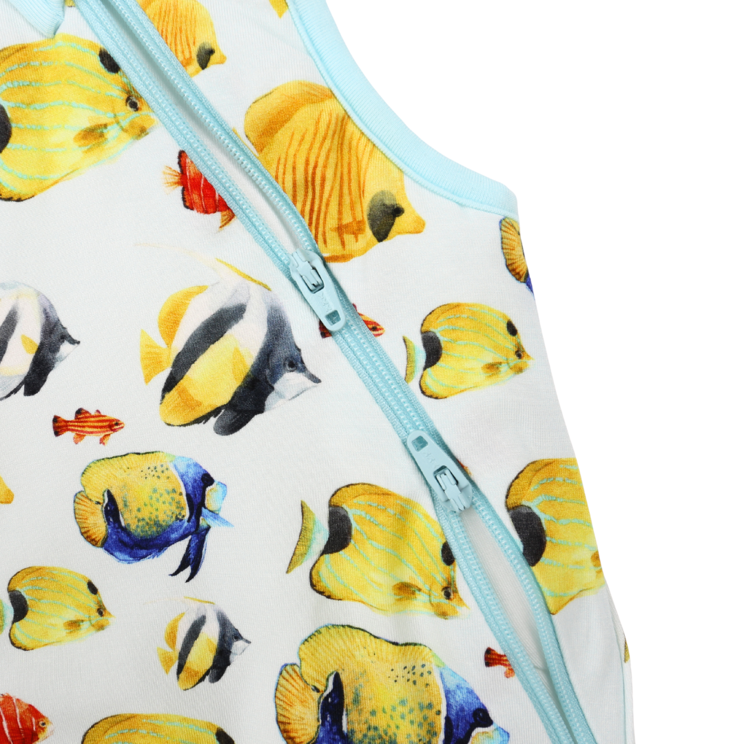 Baby romper with fish pattern and zipper on a white background