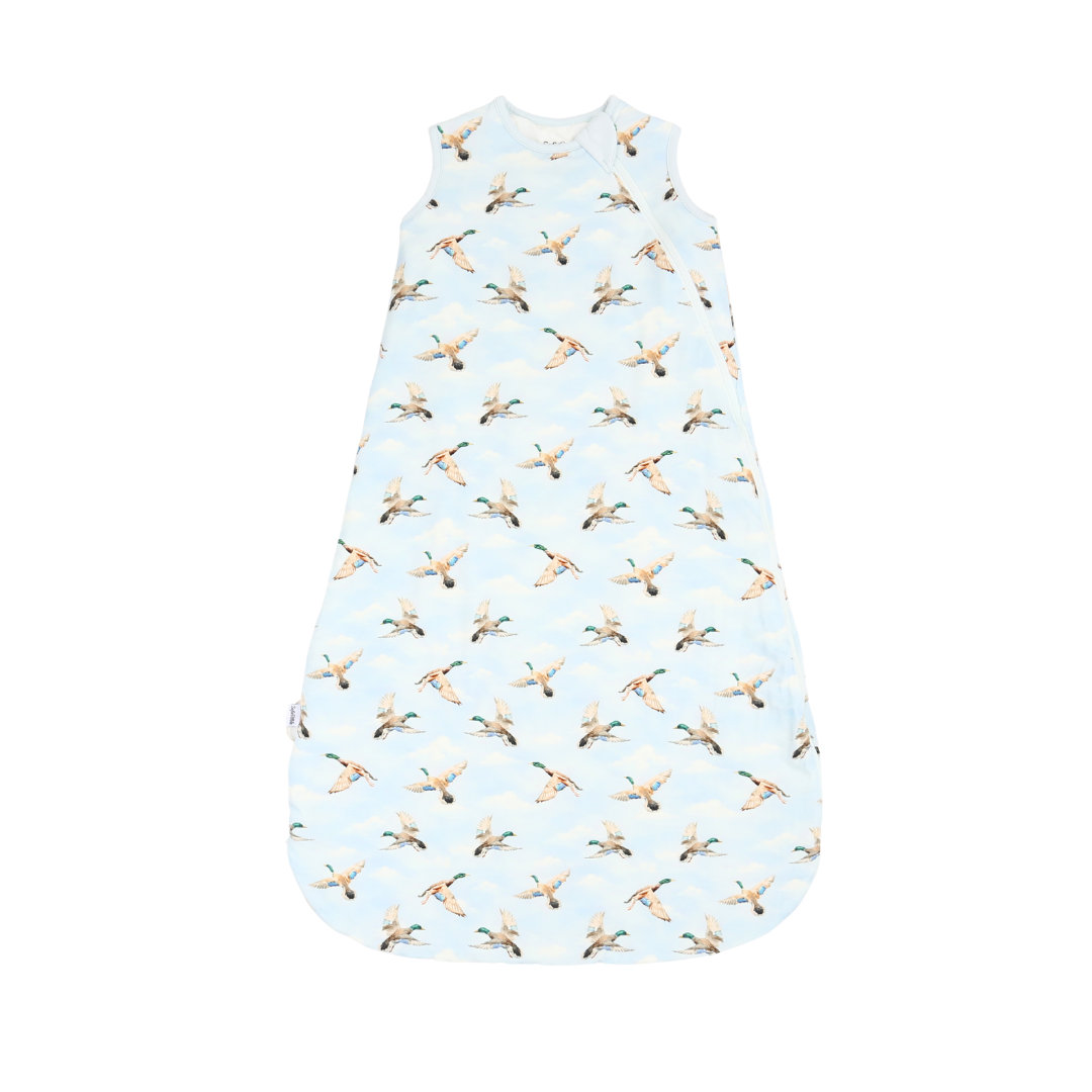 Baby sleeping bag with duck pattern on a light blue background