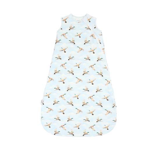 Baby sleeping bag with duck pattern on a light blue background