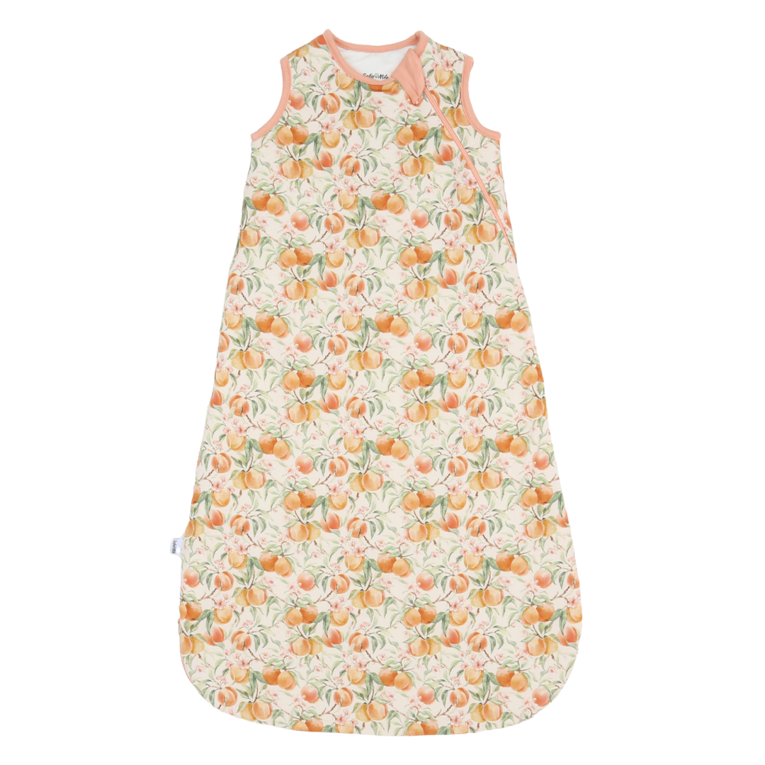 Baby sleeping bag with peach pattern on a white background