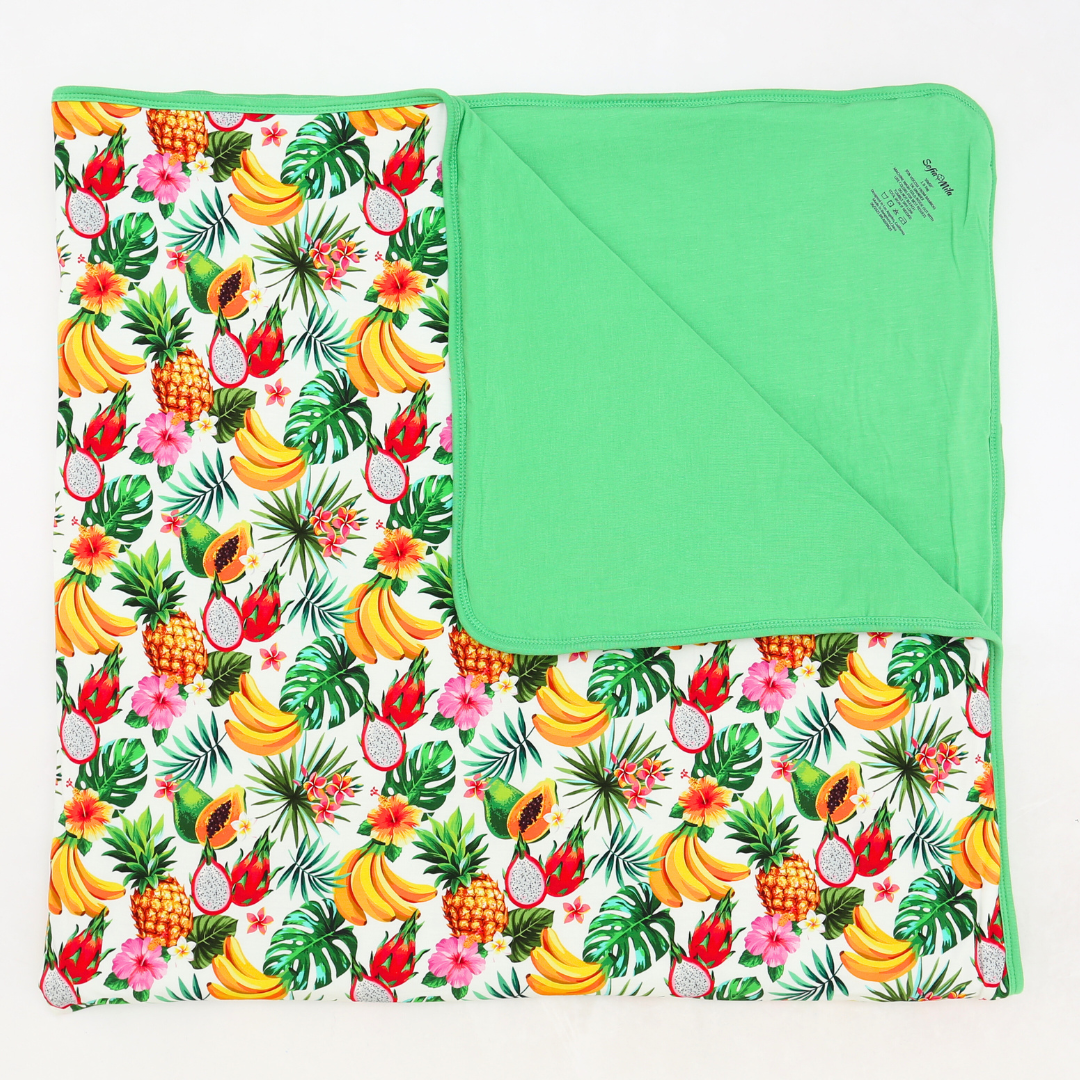 Fruit and leaf patterned blanket with green border