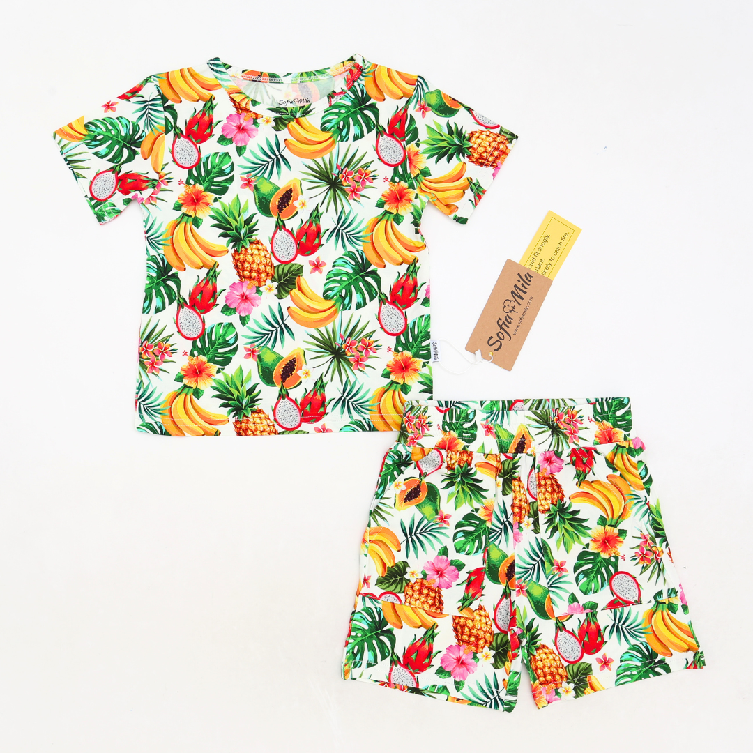 Fruit-themed children's shirt and shorts set with a visible brand tag on a white background.