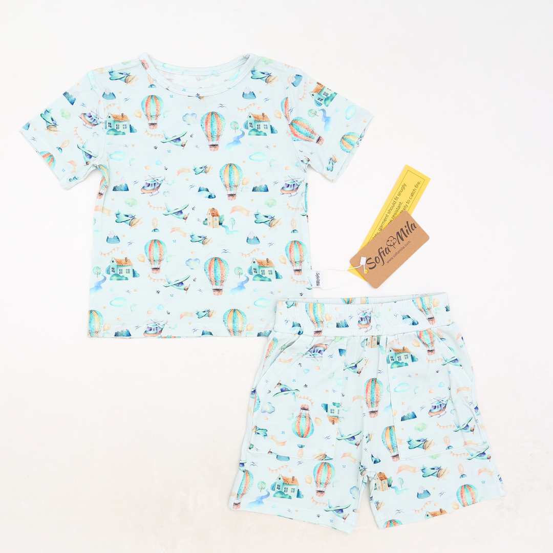 Children's t-shirt and shorts set with hot air balloon pattern on a light blue background
