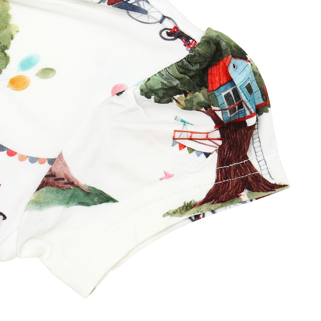 Children's fabric with a treehouse design on a white background
