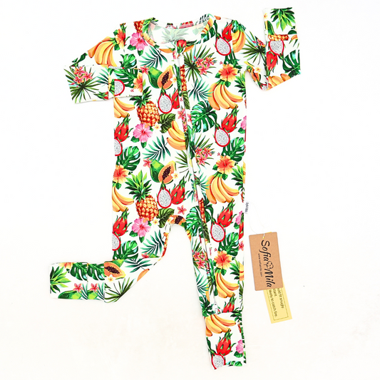 Tropical fruit patterned baby onesie with a visible brand tag on a white background