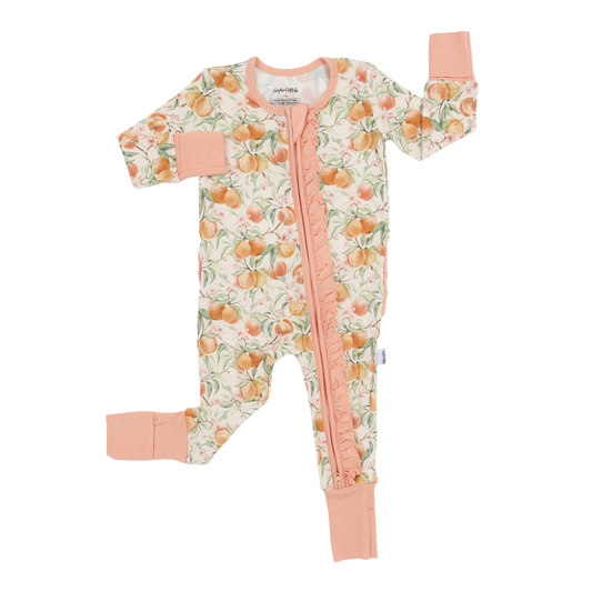 Baby onesie with peach pattern and pink accents on a white background