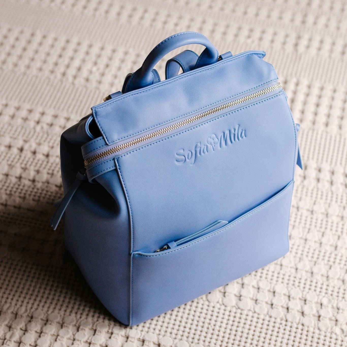 Blue backpack with 'Sofia Mila