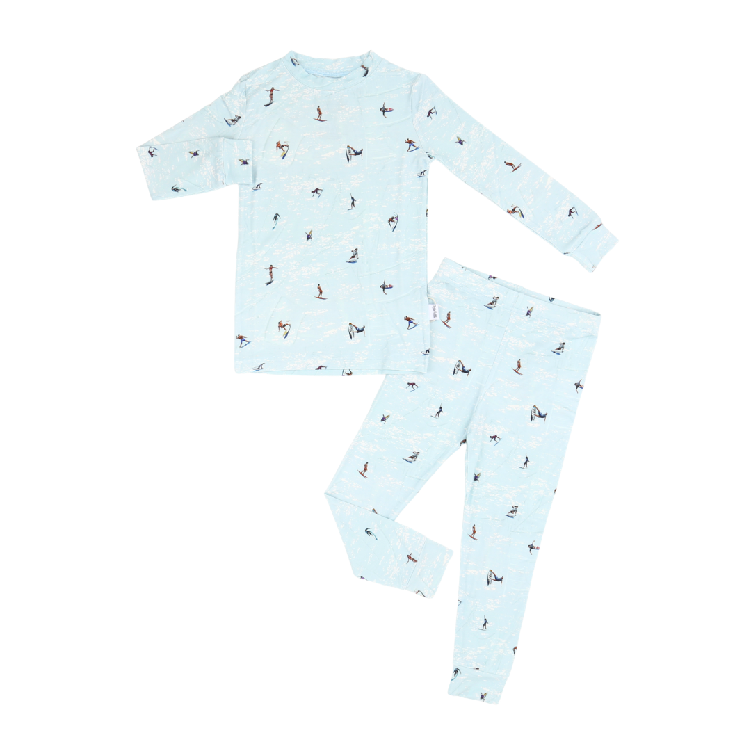 Children's pajama set with animal pattern on a light blue background