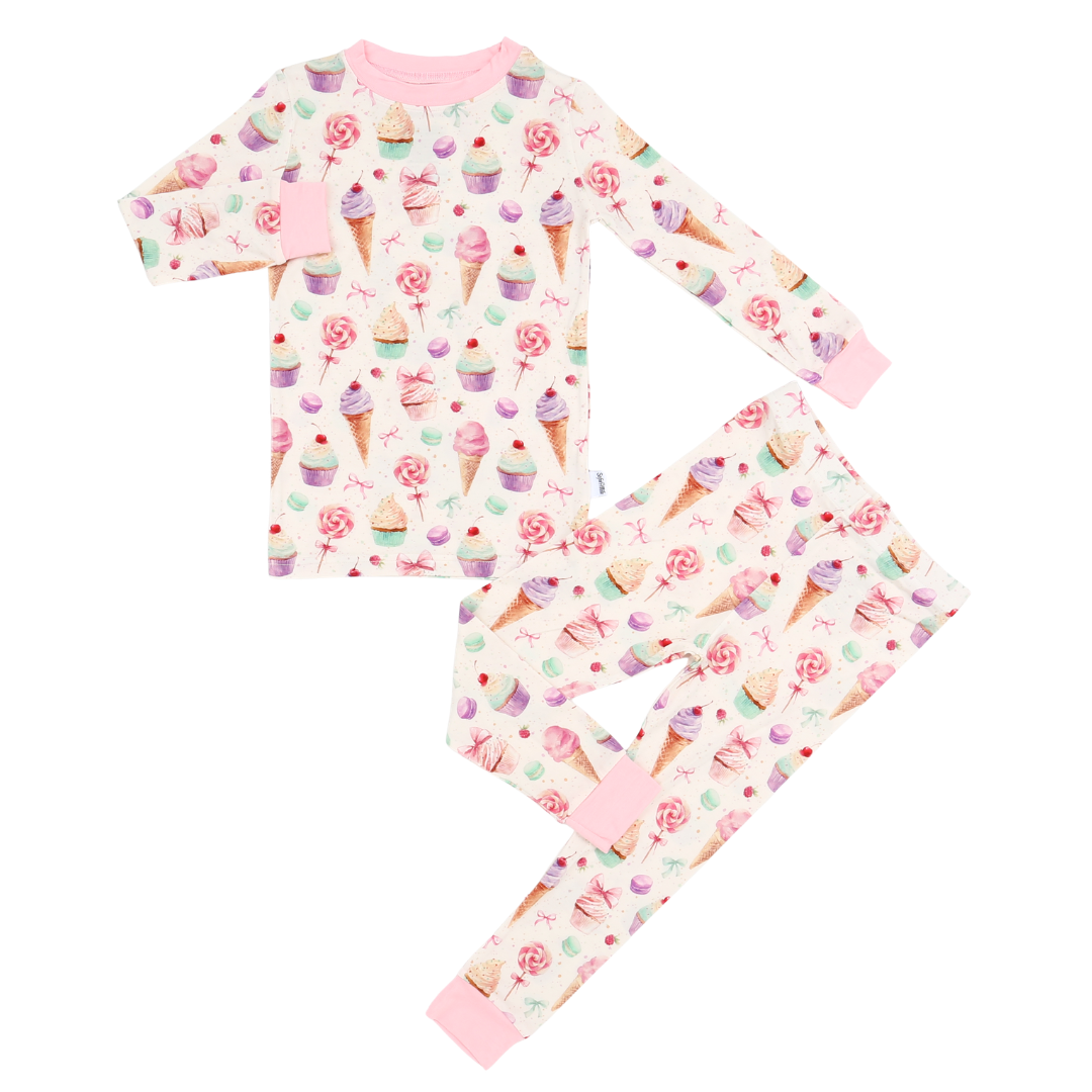 Children's pajama set with ice cream and flower pattern on a white background
