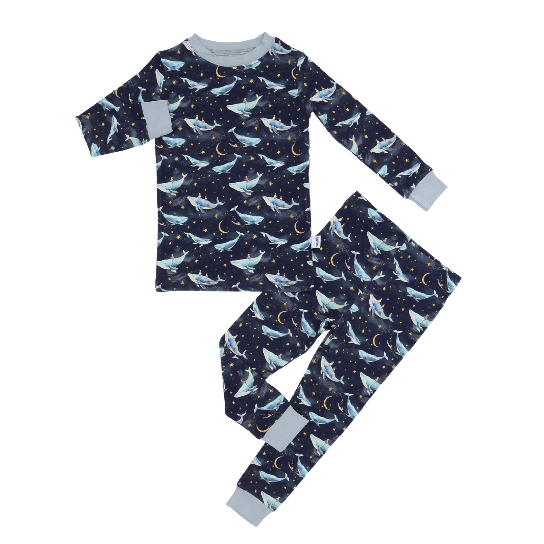 Children's pajama set with whale pattern on a white background