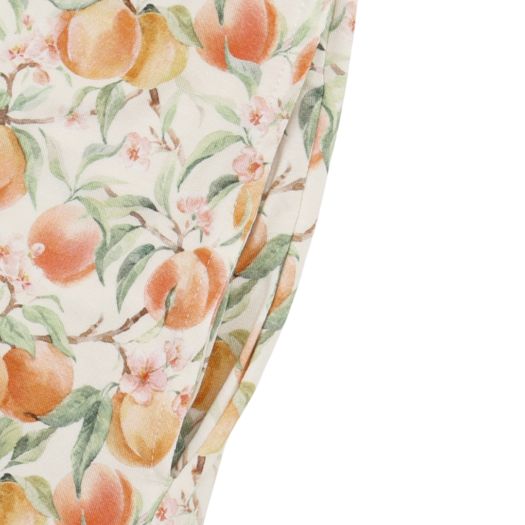 Close-up of a fabric with peach and floral pattern