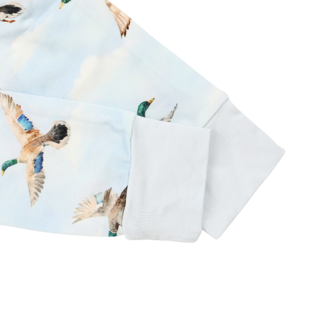 Close-up of a shirt with duck print on a white background