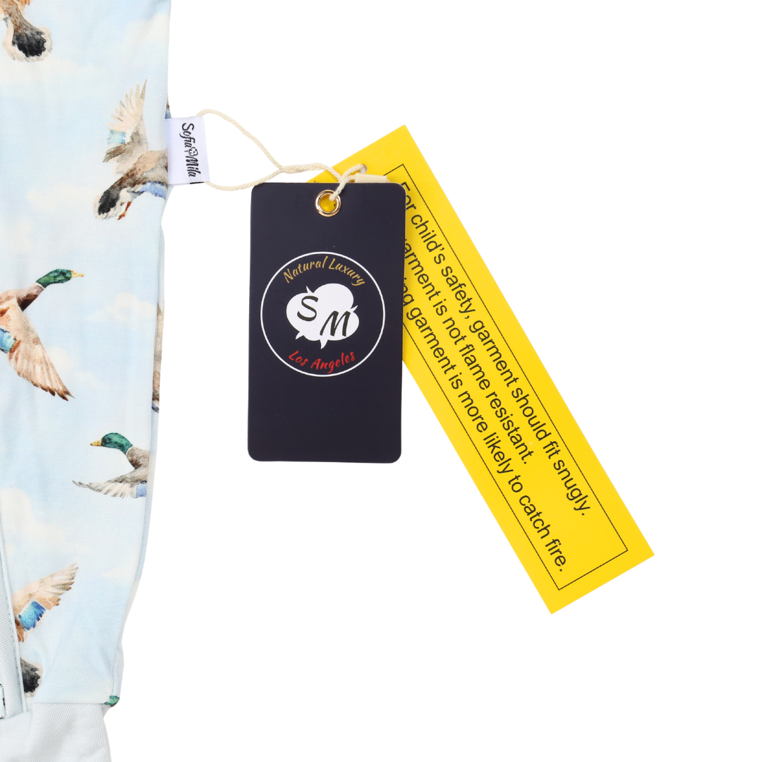 Clothing with a duck pattern and safety label on a white background