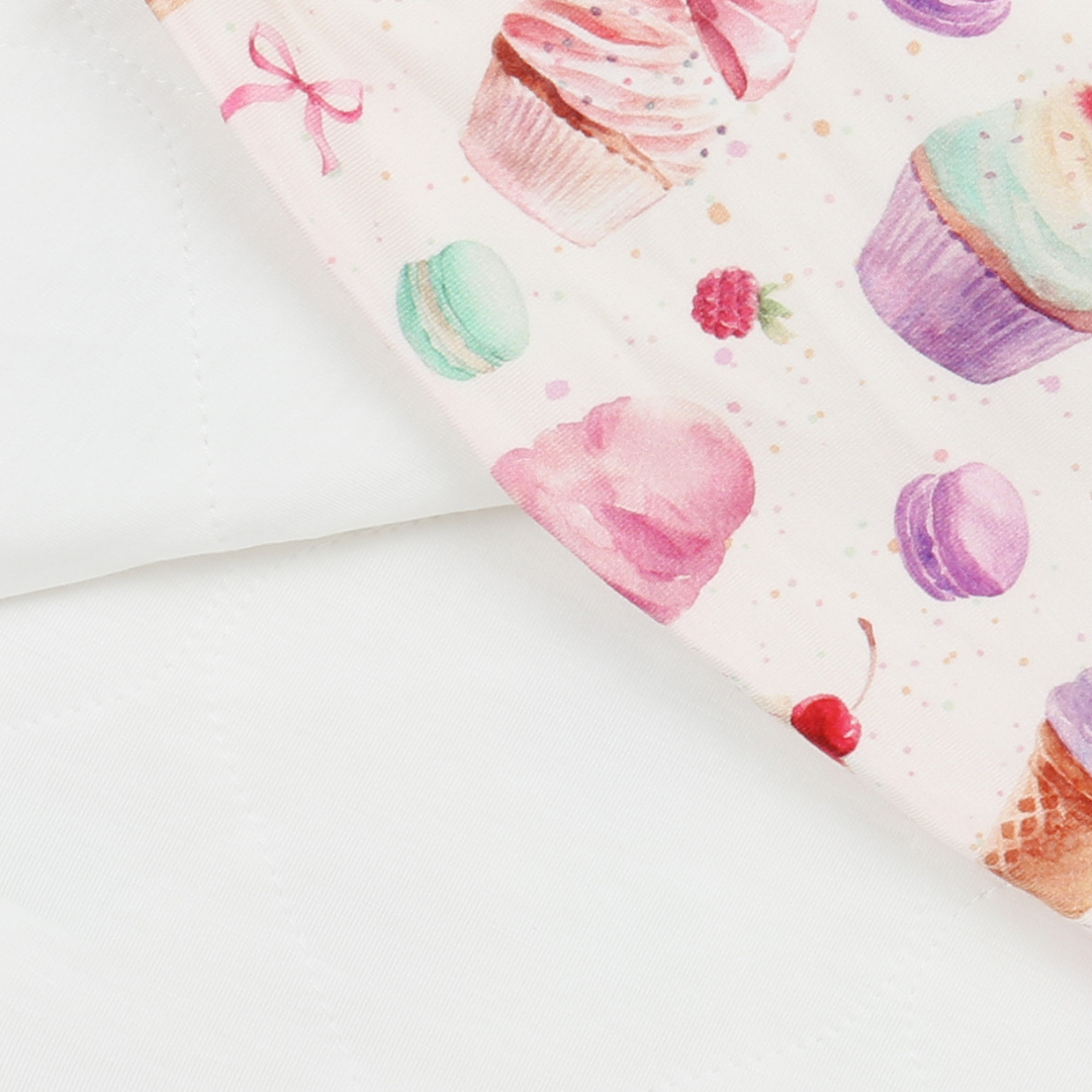 Colorful cupcake and macaron pattern on a white background
