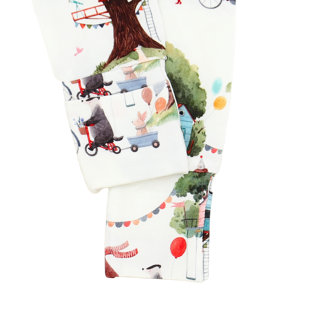 Children's fabric with animal and nature-themed pattern on a white background