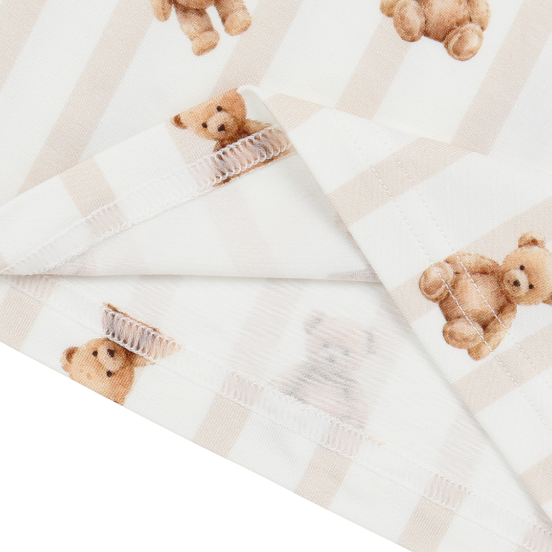 Fabric with teddy bear pattern on a white background