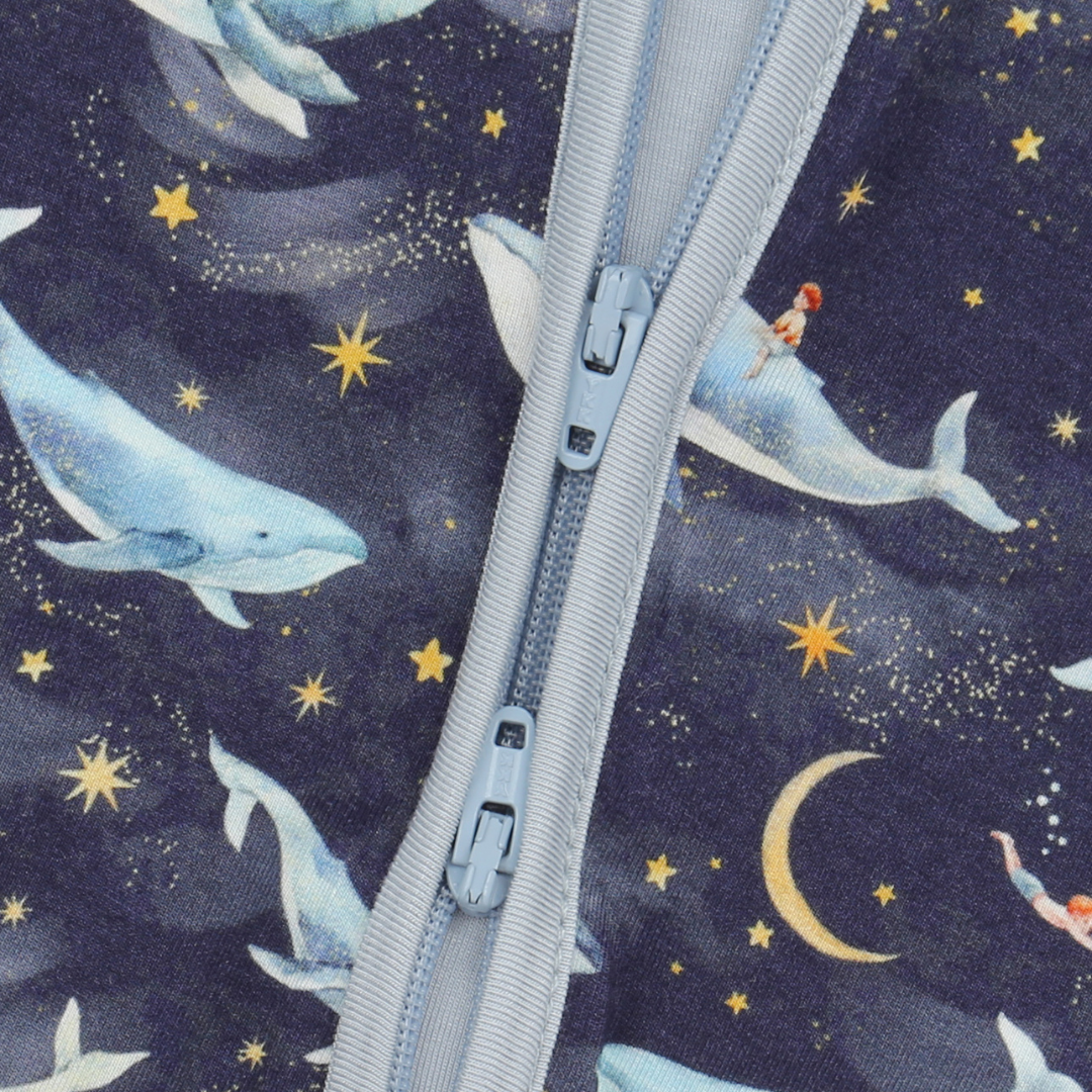 Fabric with zipper featuring whale and star pattern on a dark blue background