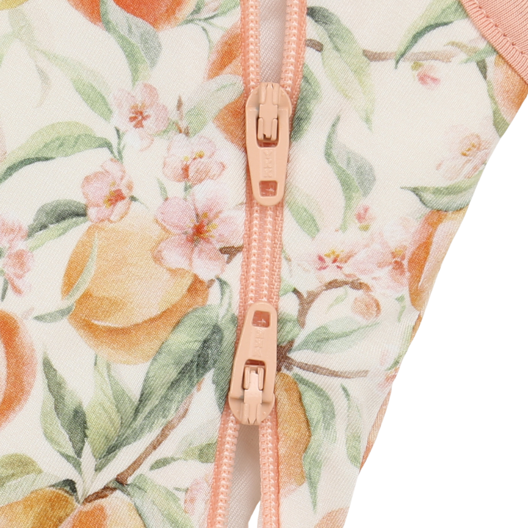Floral-patterned garment with a pink zipper