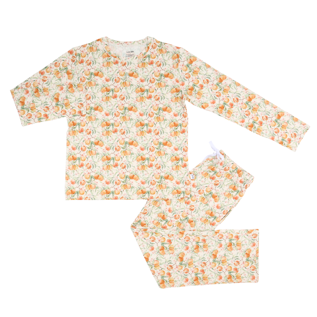 Floral pajama set with orange and green pattern on a white background