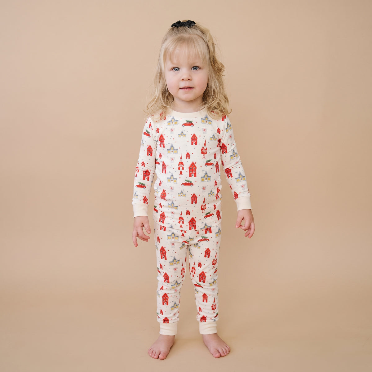 Girl wearing Christmas bamboo pajamas for toddlers