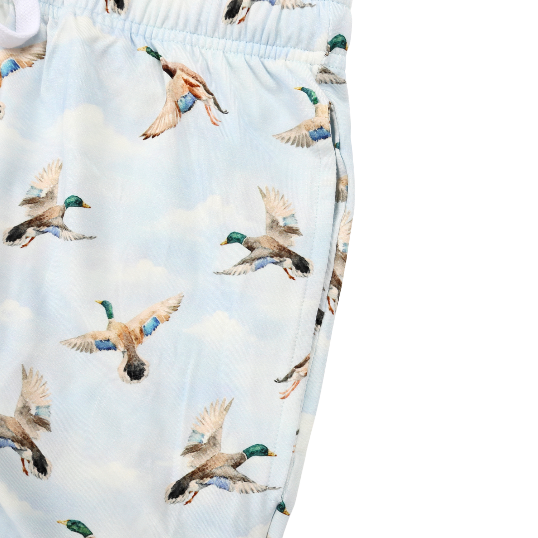 Pajama shorts with duck pattern on a light blue background