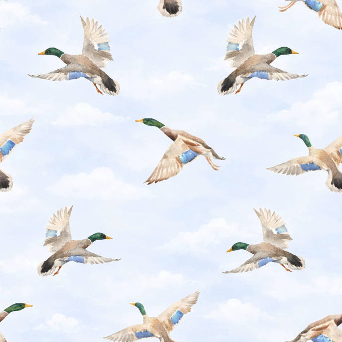 Pattern of flying ducks on a light blue background
