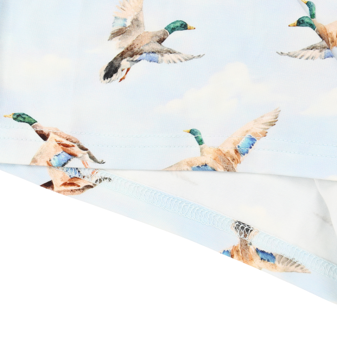 Pattern of flying ducks on a white background