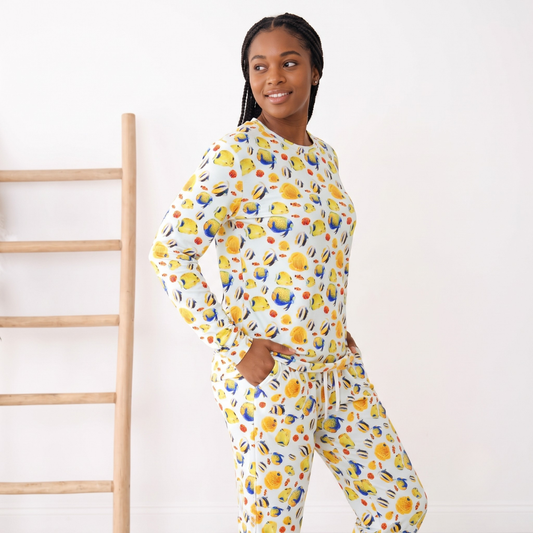 Person wearing a colorful pajama set with a white background