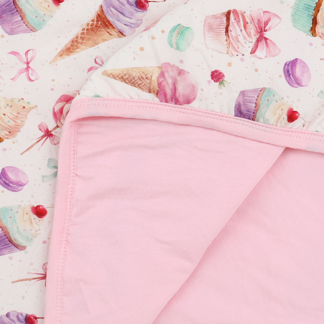 Pink fabric with ice cream cone pattern on a white background