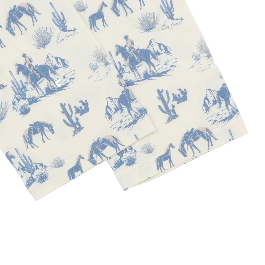 Sheet set with blue desert scene design featuring horses and riders on a white background