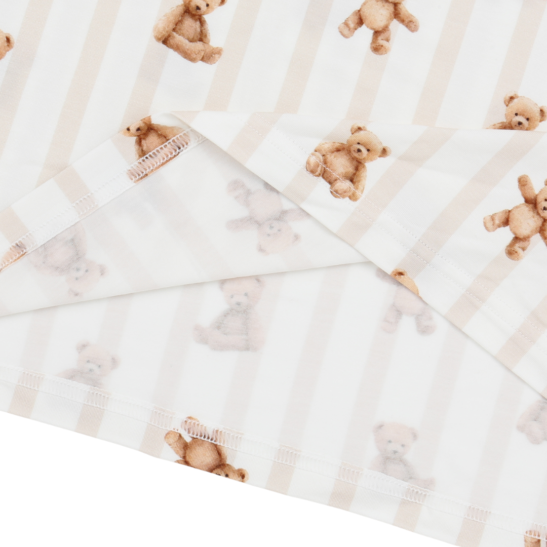 Sheets with teddy bear pattern on a white background