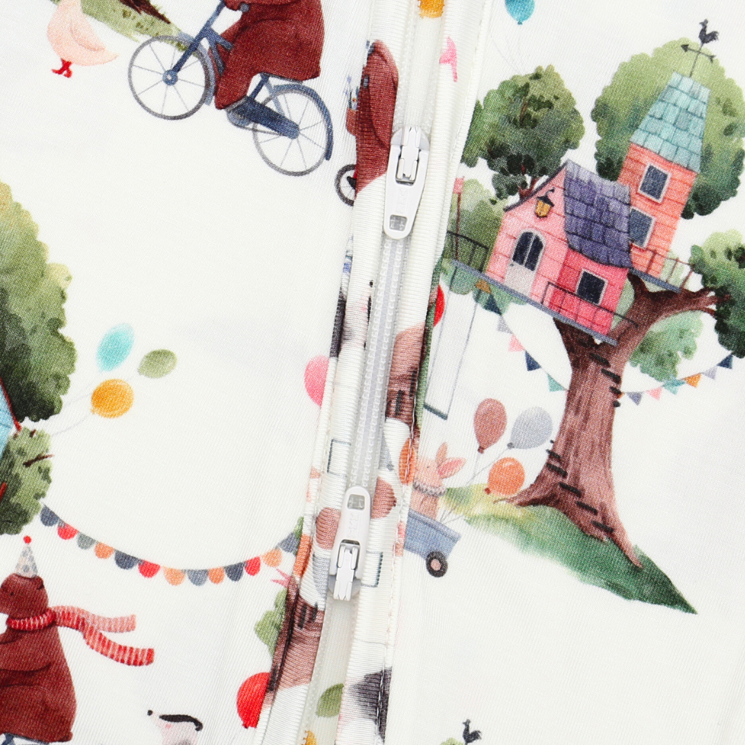Patterned fabric with tree house, bicycle, and characters on a white background