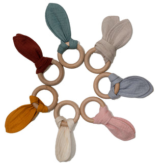 Teething toy with wood wring and muslin fabric 